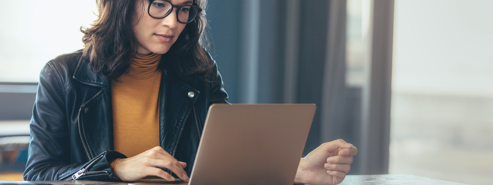 Woman using laptop for business-banner