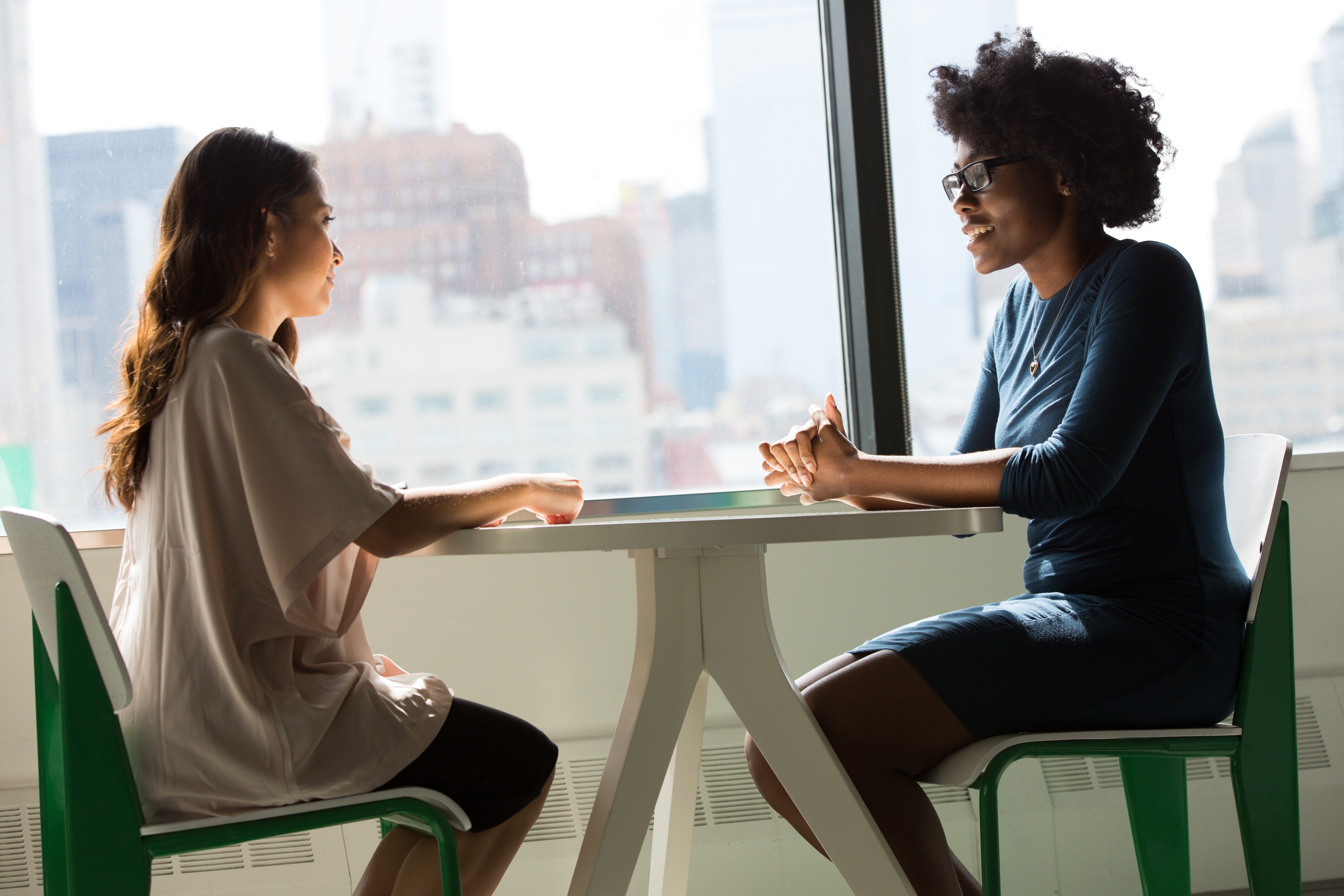 A seller speaks with their real estate agent 