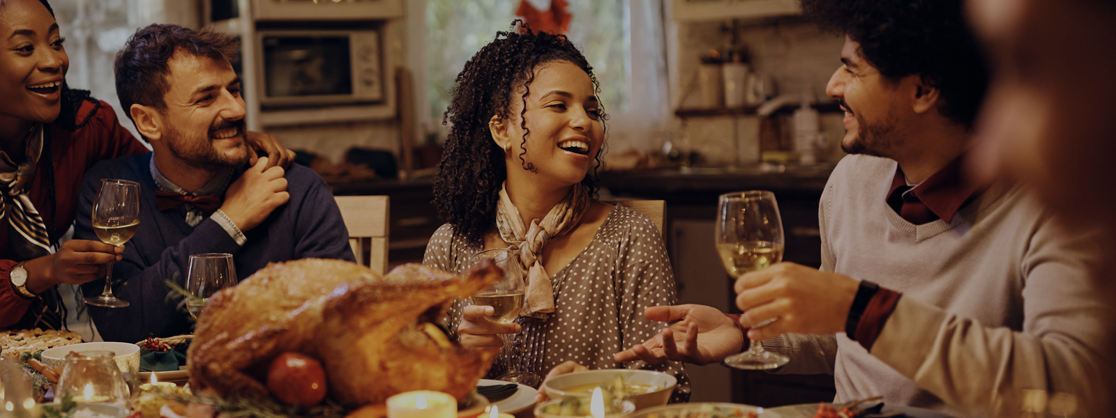 A group of people gathered around a holiday dinner. 