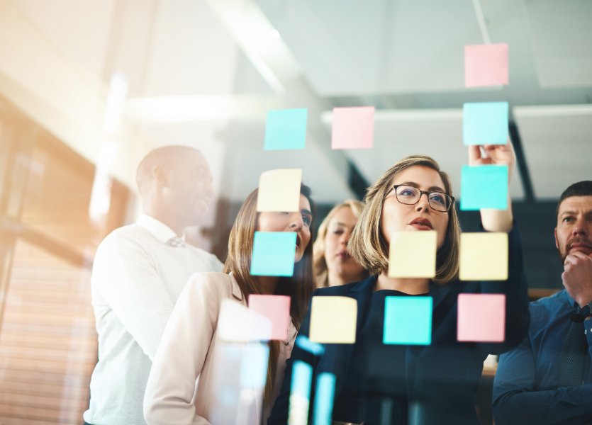 A group of people brainstorm new ideas. 