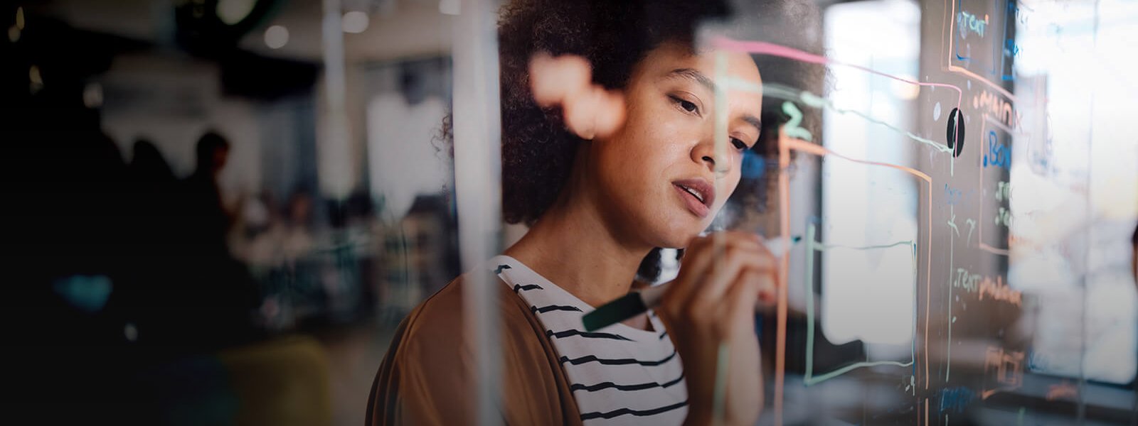 woman-at-a-desk-talking-on-the-phone-banner