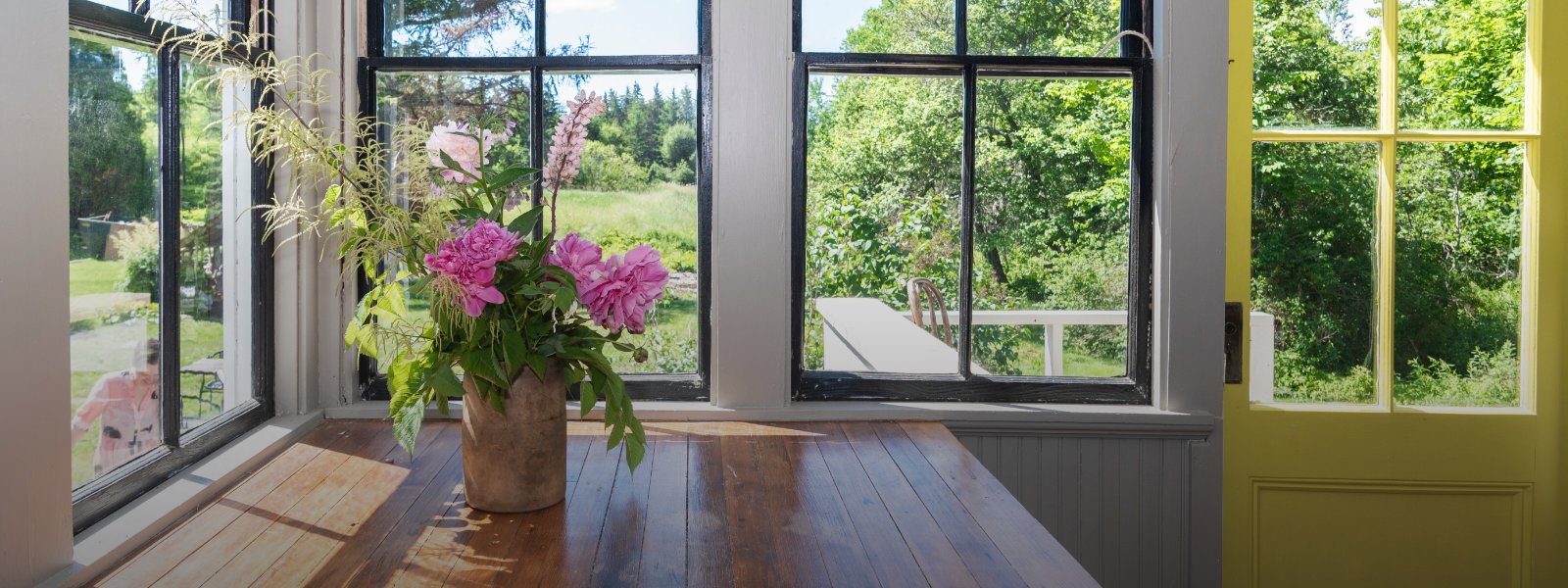 pretty-desk-area-with-spring-flowers-with-real-estate-tips-banner