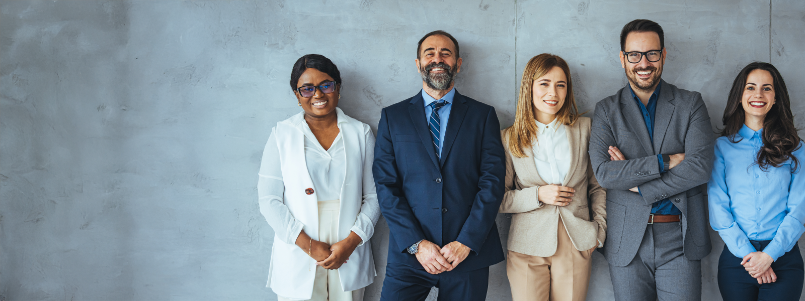 business-people-standing-together-against-wall