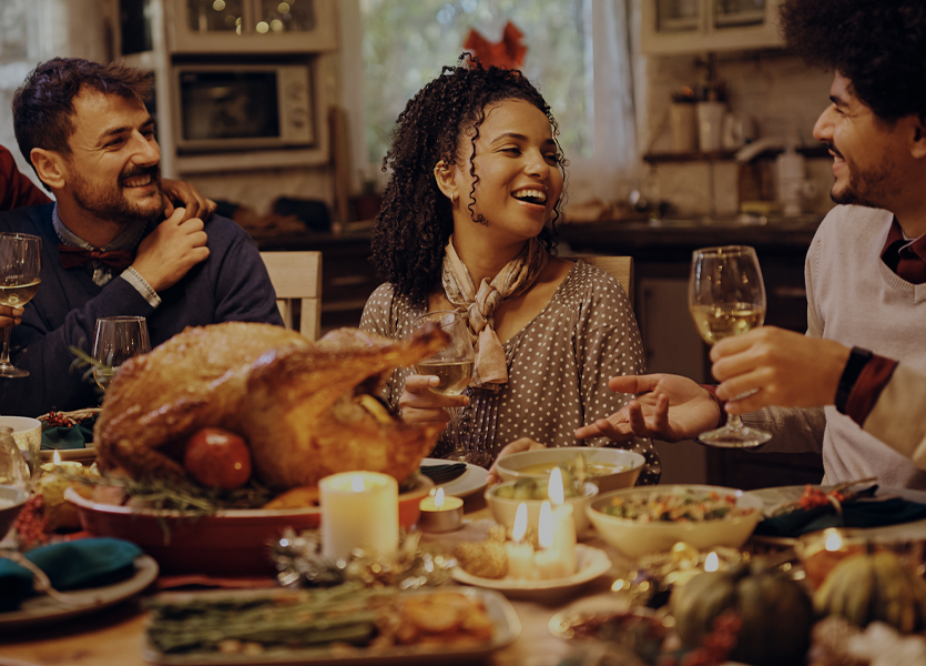 A group of people gathered around a holiday dinner. 